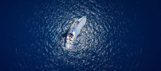 Fototapeten Amazing view to Yacht sailing in open sea at windy day. Drone view © dell
