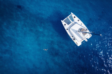 Catamaran in open sea - aerial / drone view - 101902639