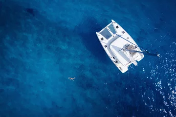 Fotobehang Catamaran in open sea - aerial / drone view © dell