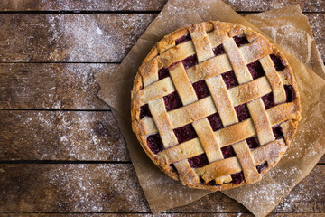  tart with berries jam on wooden background