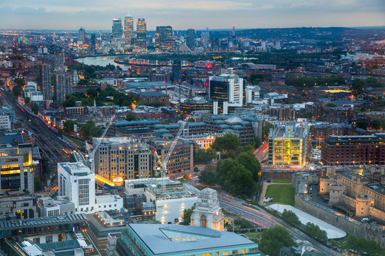 London at sunset, aerial view includes famous buildings, streets and Canary Wharf aria at distance 