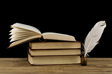 old books and pen