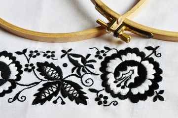 white and black traditional folklore embroidery next embroidery frame