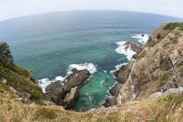 Fototapeta na wymiar Ocean Rocky Cliffs blue sea waters coastline landscape
