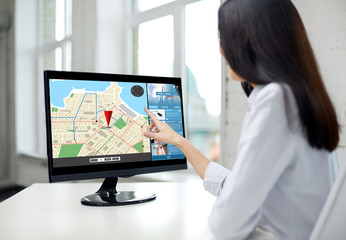 close up of woman with navigator map on computer