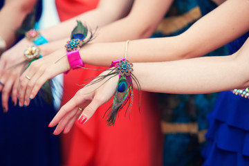 hands of bridesmaids with bracelets
