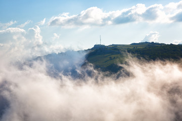 Fototapeta na wymiar Clouds move below rocks on the mountain Ai Petri, Crimea