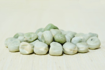 Peas on wooden board