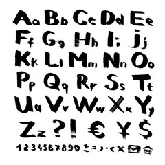 Alphabet and symbols from black brush strokes on white background