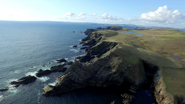 Aerial shot off the dramatic coast line of Shetland, Scotland,
