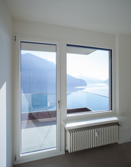Empty room in modern house, lake view
