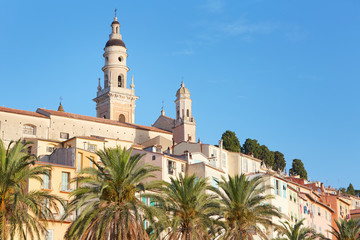 Fototapeta na wymiar Menton bell tower and old city houses in the morning, French riviera