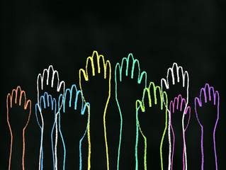 Class Participation - Colored chalk drawing on blackboard of all hands raised up