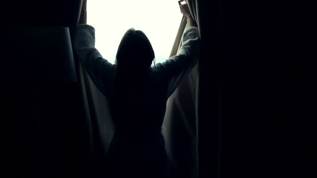 Woman unveil curtains admire view from window, super slow motion 240fps
