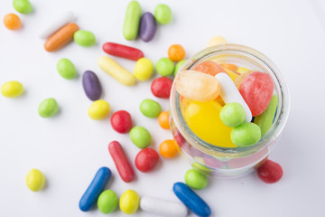 Multicolor candies in glass jars