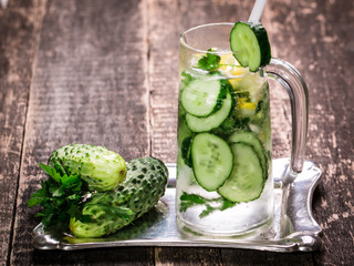 Fresh cold cucumber drink on wooden table