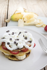 pancakes with strawberries, banana, blueberries and chocolate...