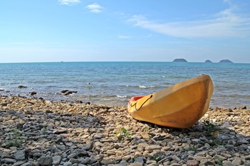 canoe on the stone beach