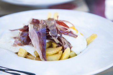 iberian ham eggs and french fries