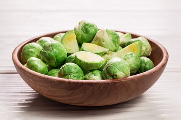 Fresh brussel sprouts over rustic wooden texture.healthy food