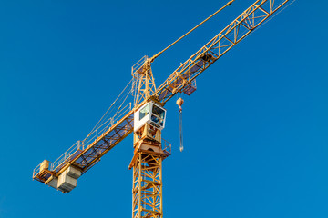 Naklejka premium Crane. Blue sky.