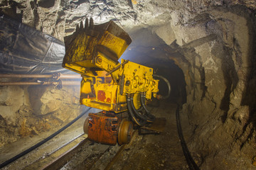 Underground gold mine shaft ore loading machine