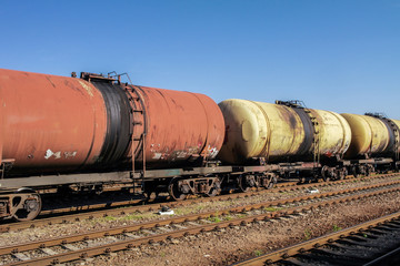 Freight trains.Railroad train of tanker cars transporting crude oil on the tracks.