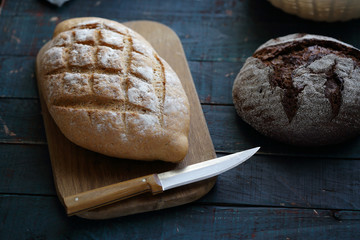 bread and knife on chopping board