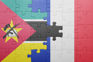 puzzle with the national flag of mozambique and france