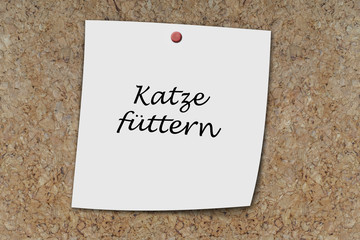 Katze füttern written on a memo