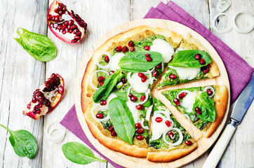 spinach pesto mozzarella onion pomegranate pizza