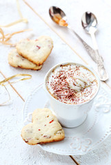 cup of coffee with cream on a white background