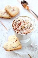 cup of coffee with cream on a white background