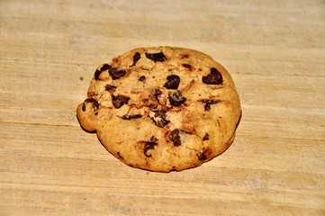 Chocolate cookies on wood background