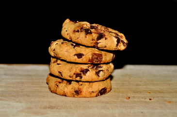 Chocolate cookies on wood background