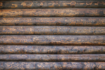 Wooden wall from logs as a background texture