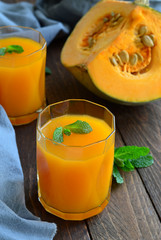 Pumpkin Orange Drink on wooden background