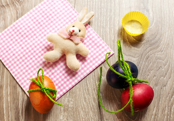 easter concept with colorful edible eggs and bunny toy