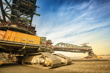 One side of huge coal mining drill machine photographed from a ground with wide angle lens....