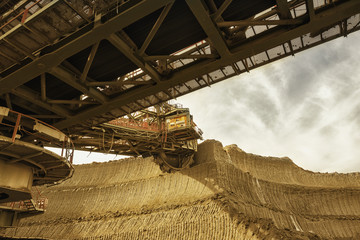 One side of huge coal mining drill machine photographed from a ground with wide angle lens....