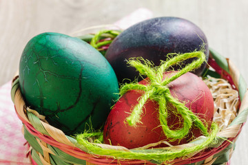 hand made painted easter eggs inside basket