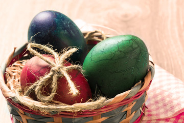hand made painted easter eggs inside basket