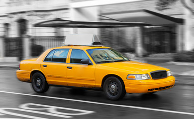 Yellow cab in Manhattan in a rainy day.