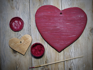 stain wooden Valentines hearts in red color