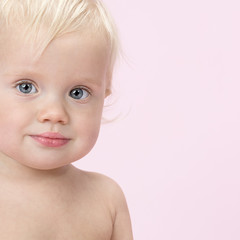 little child baby portrait on pink background
