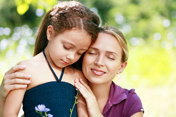 Fototapeta premium mother and little daughter on nature