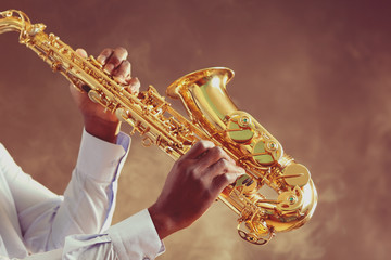 African American jazz musician playing the saxophone, closeup