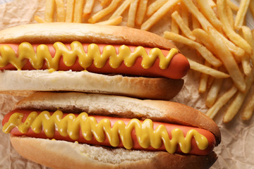 Hot dogs and fried potatoes closeup