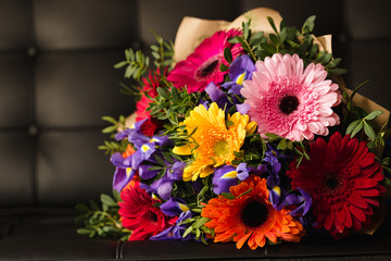 Flowers bouquet of gerbera, iris, and pistacia