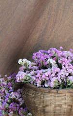 Fototapeta premium Beautiful flowers on the wooden floor.